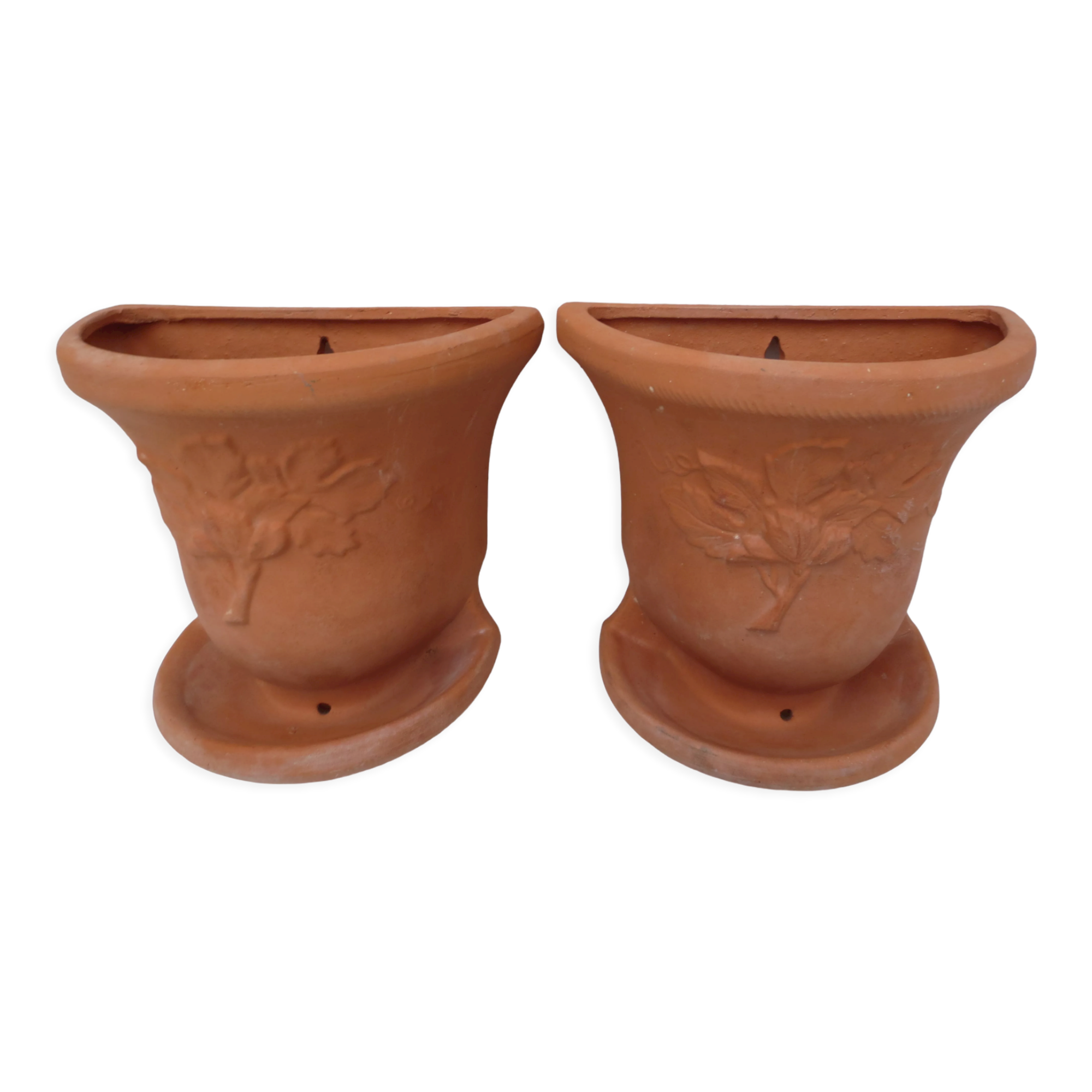 Duo of decorated terracotta wall flowerpots