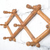 Wall accordion coat holder