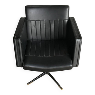 Black swivel club armchair in faux leather with golden metal base, Czechoslovakia 1960s.