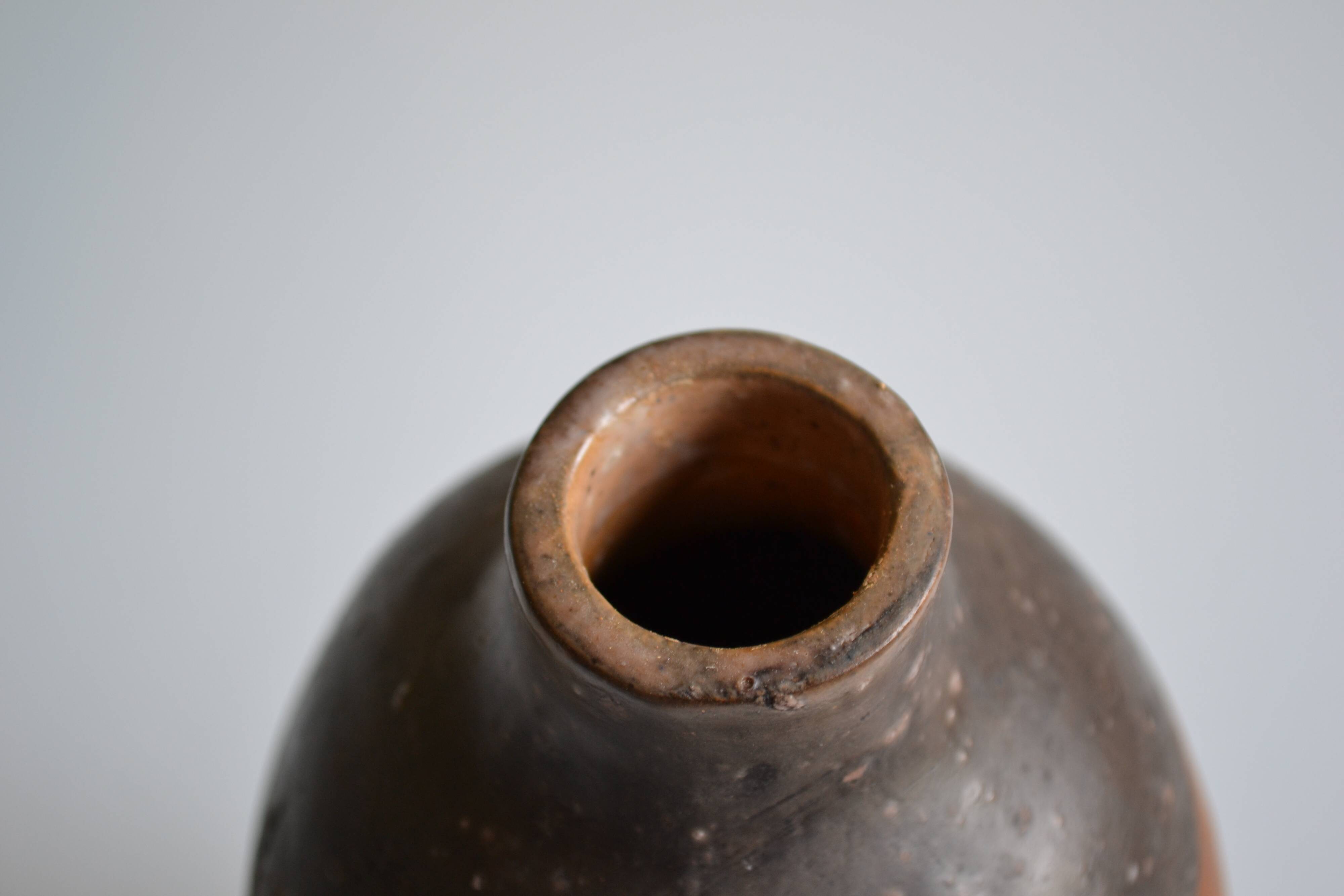 Bottle vase decorative flowers ceramic signature with fish to identify.