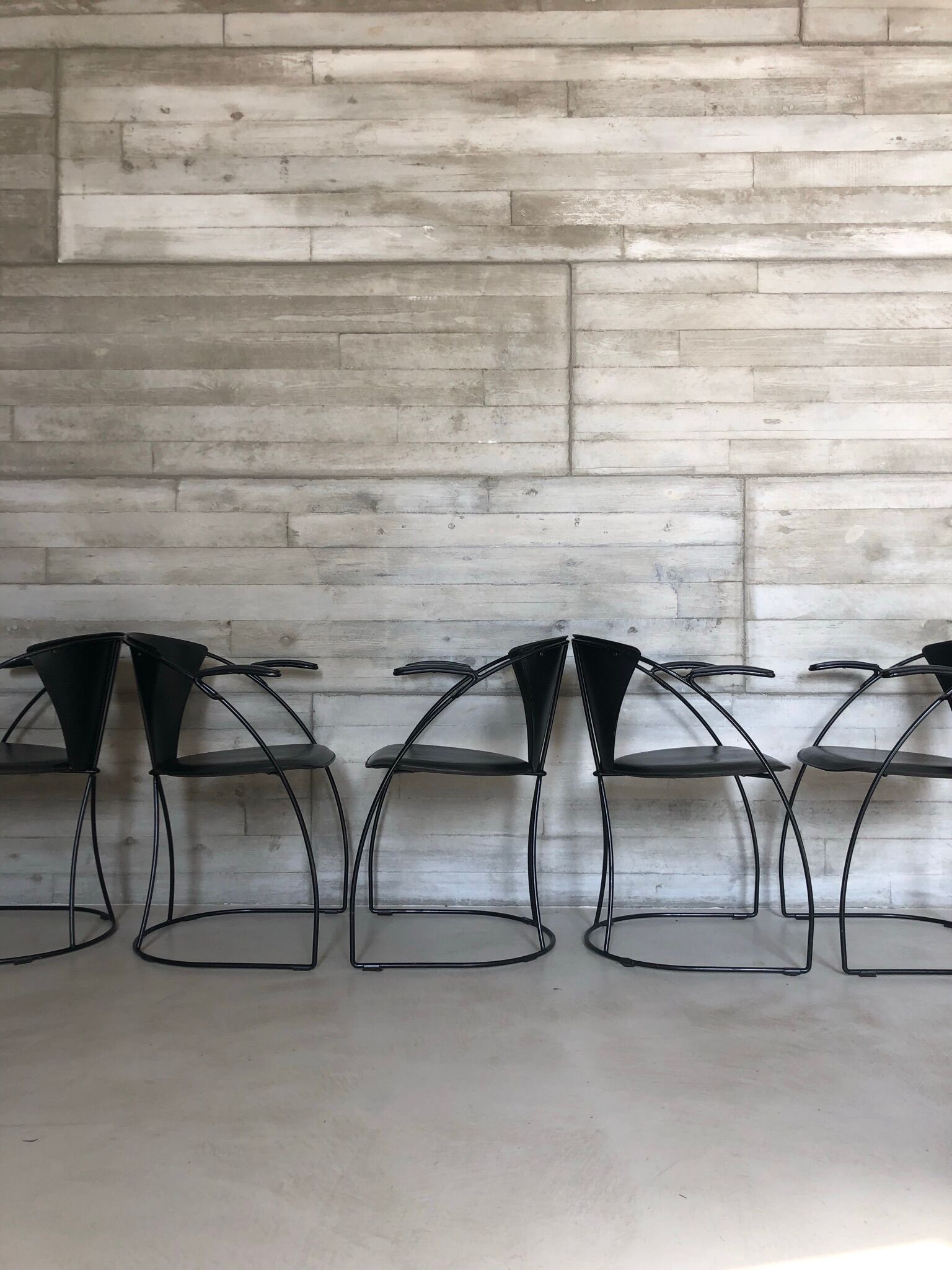 “Armlinda” black leather dining chairs by Arrben Italy