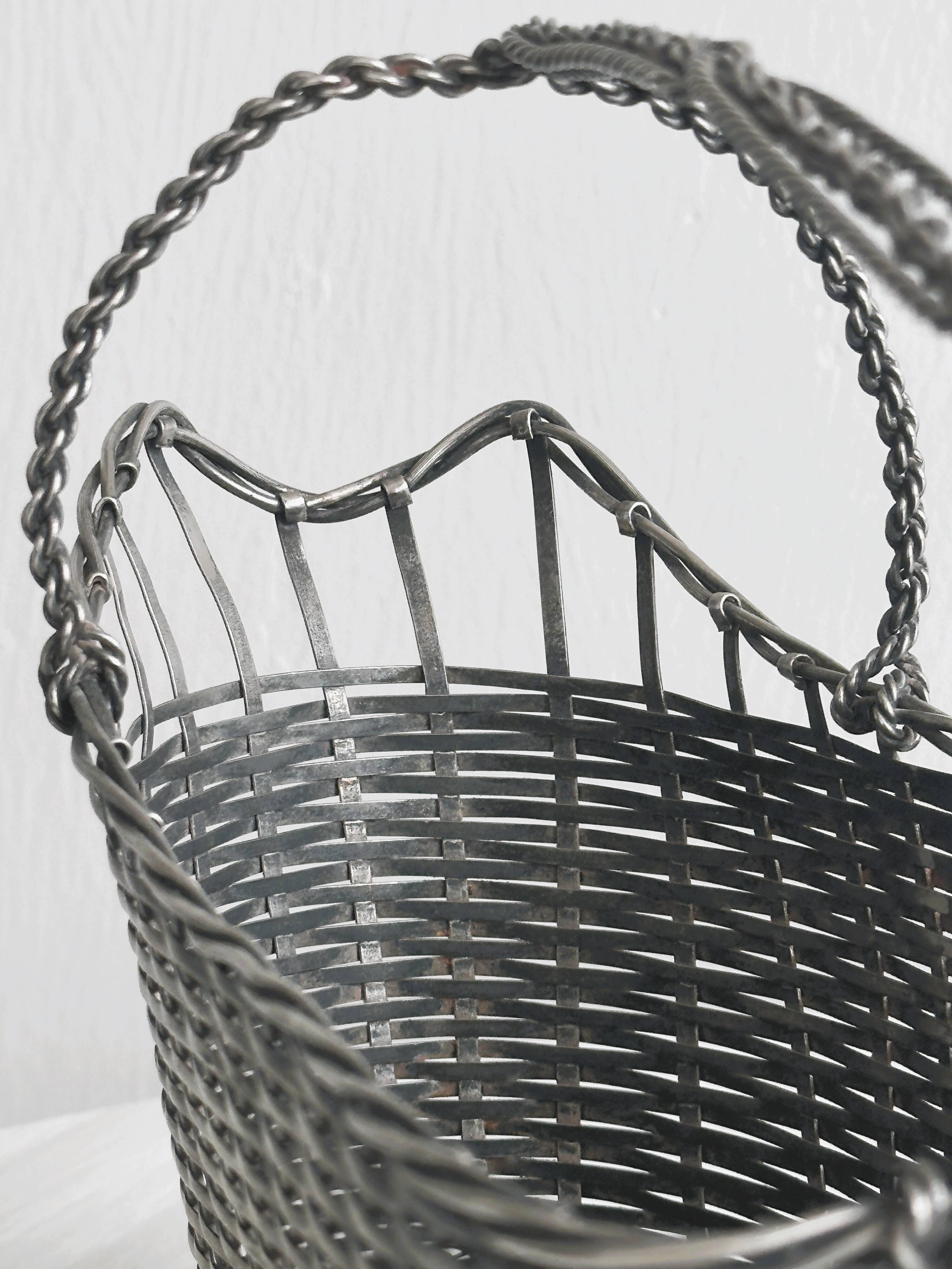 Woven metal wine basket
