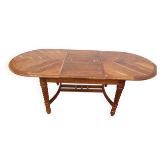 Oval table in exotic wood, integrated extension