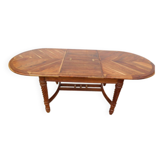 Table ovale en bois exotique, rallonge intégrée
