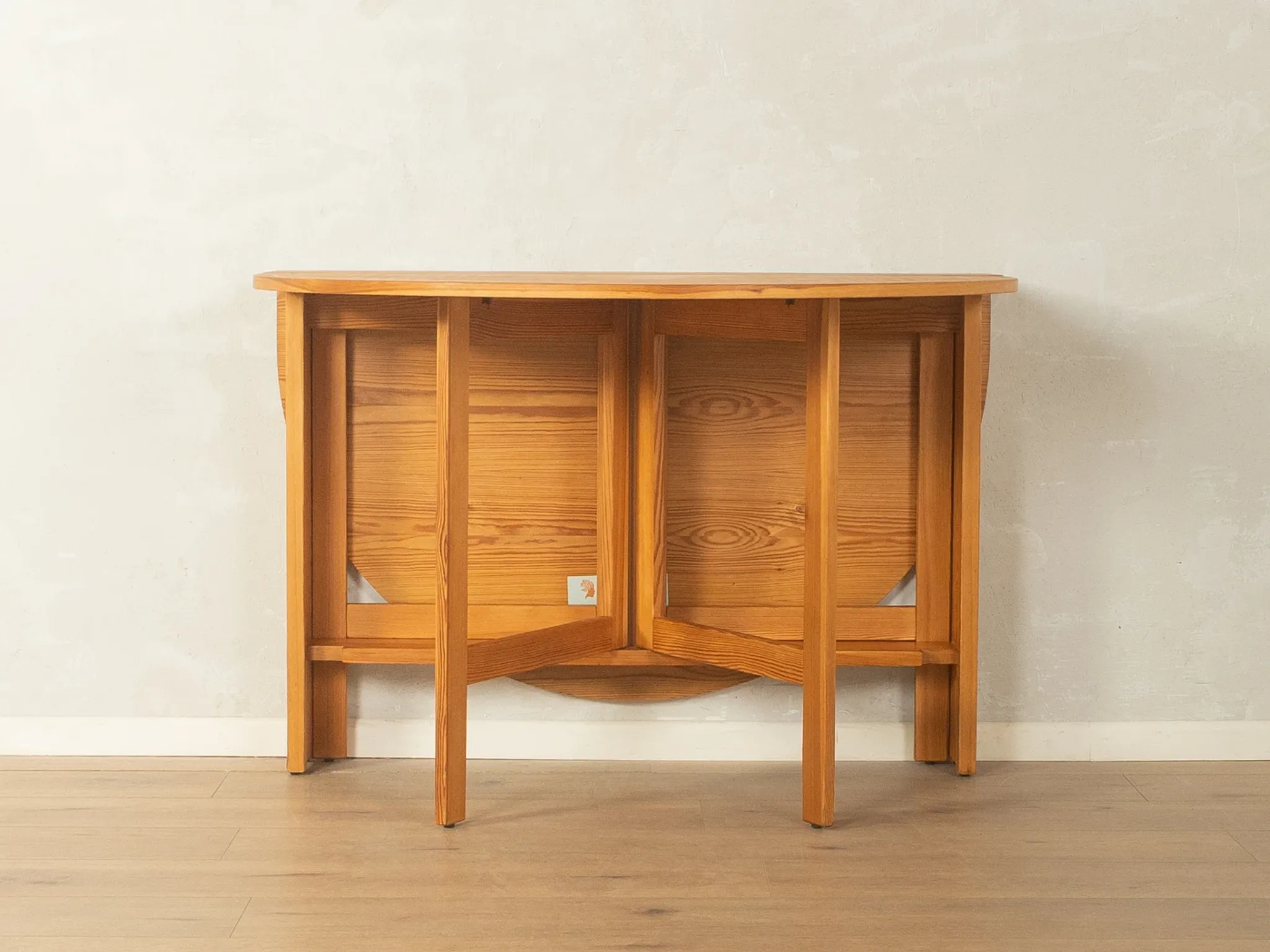 Practical folding table from the 1980s made of light brown pine wood
