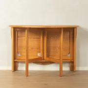 Practical folding table from the 1980s made of light brown pine wood