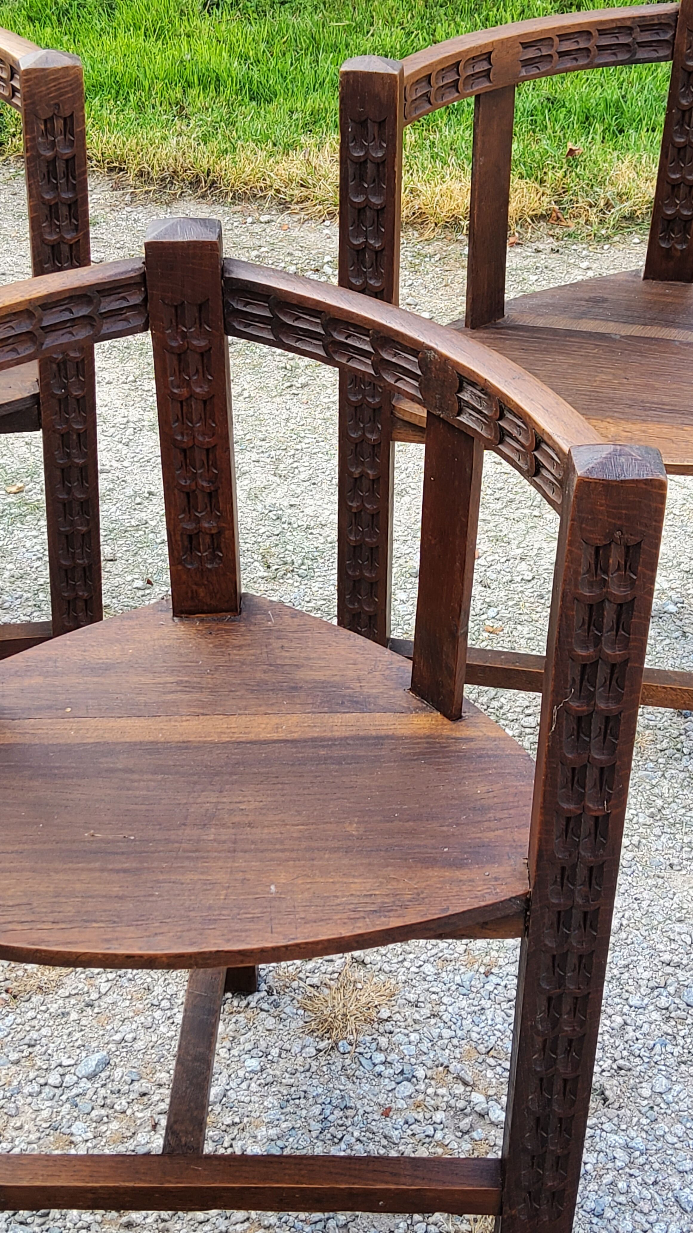 Set of three brutalist tripod armchairs in carved solid oak