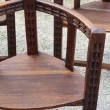 Set of three brutalist tripod armchairs in carved solid oak