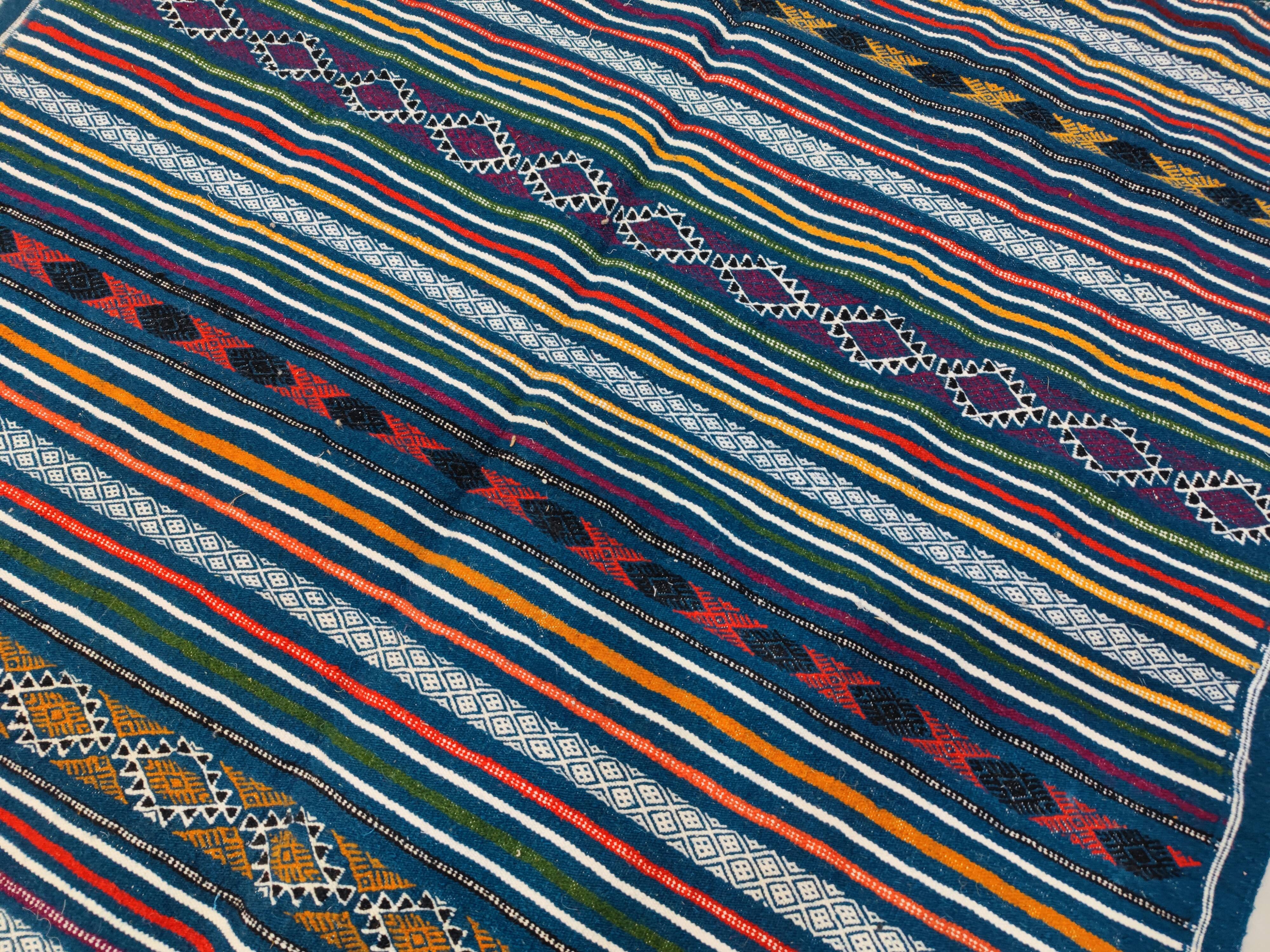 Handwoven blue kilim rug in natural wool
