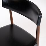 Set of four dining room chairs in rosewood and black leather of danish design from the 1960s.