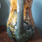 Vintage barbotine pitcher with floral decoration