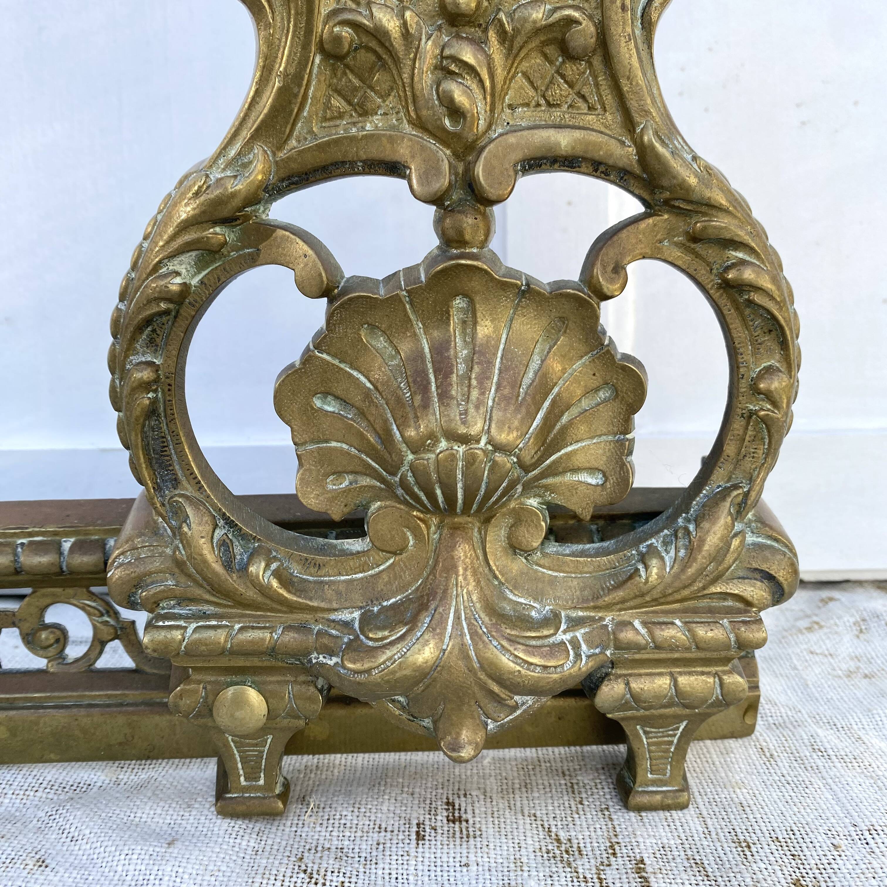 Antique brass fireplace set, bar and andirons, Napoleon I style.