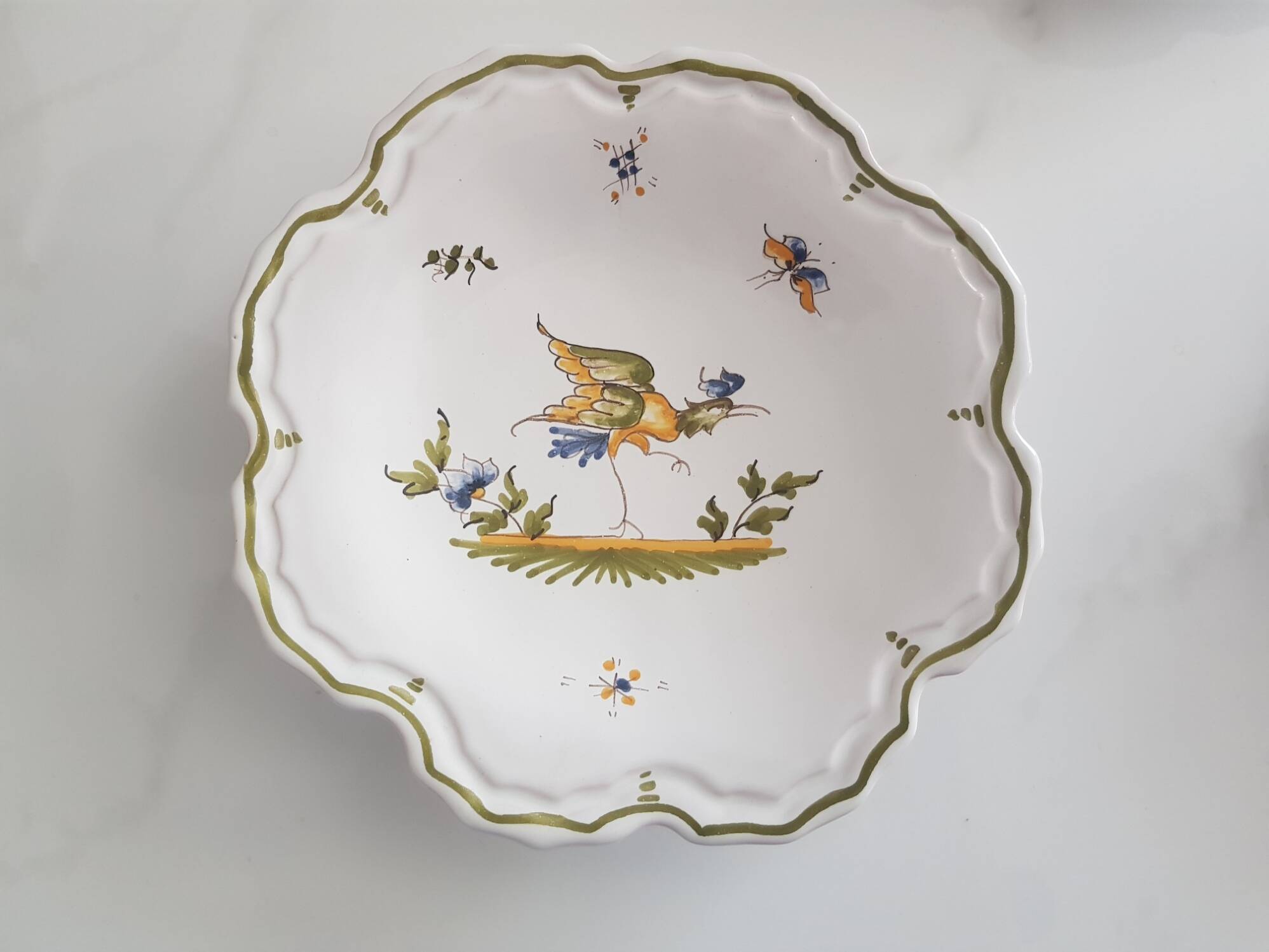 3 small signed Moustiers decorated plates with lace