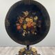 Napoleon III guéridon table in black lacquered wood with floral painted decoration, 19th century.