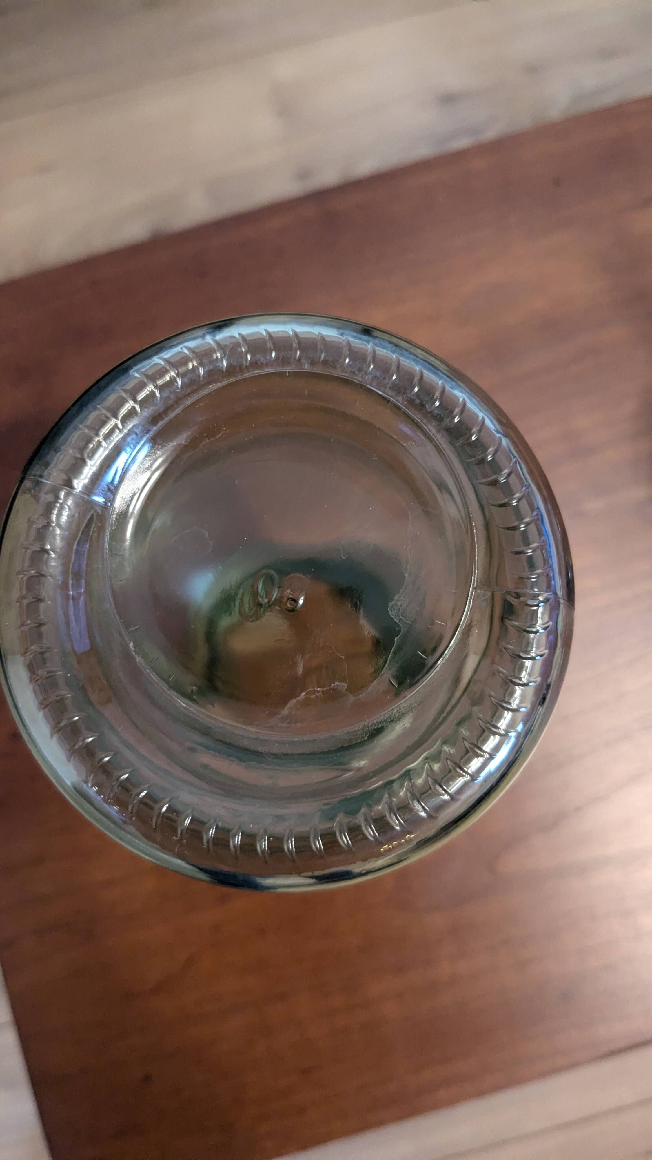 Old green milk bottle