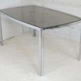 Living table. chrome metal, curved smoked glass slab, france, circa 1970.
