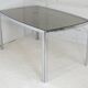 Living table. chrome metal, curved smoked glass slab, france, circa 1970.