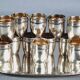Antique silver-plated/gold liquor service with 12 goblets, tray + case.