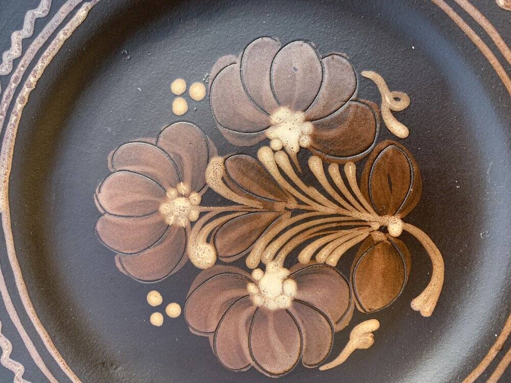 Wall plaque in black and brown ceramic, hand-painted flowers, Hungary 1970s