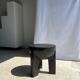 Black mango wood tripod side table with a semi-spherical top, height: 45 cm, diameter: 44 cm.