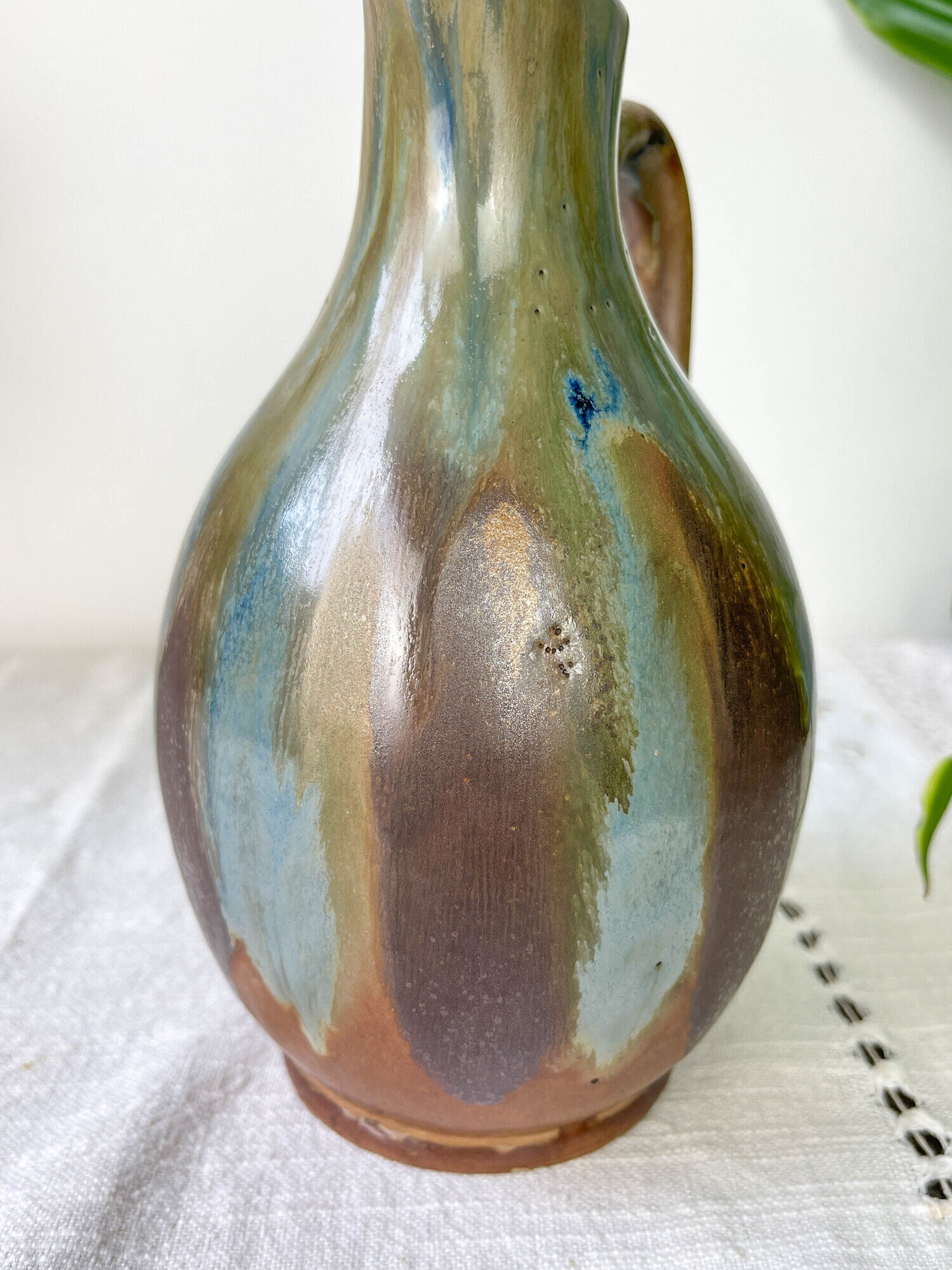 Art Nouveau style carafe in flamed stoneware with blue and brown drips
