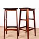 4 Danish high stools, rosewood and black leather, Knud Bent for Dyrlund.
