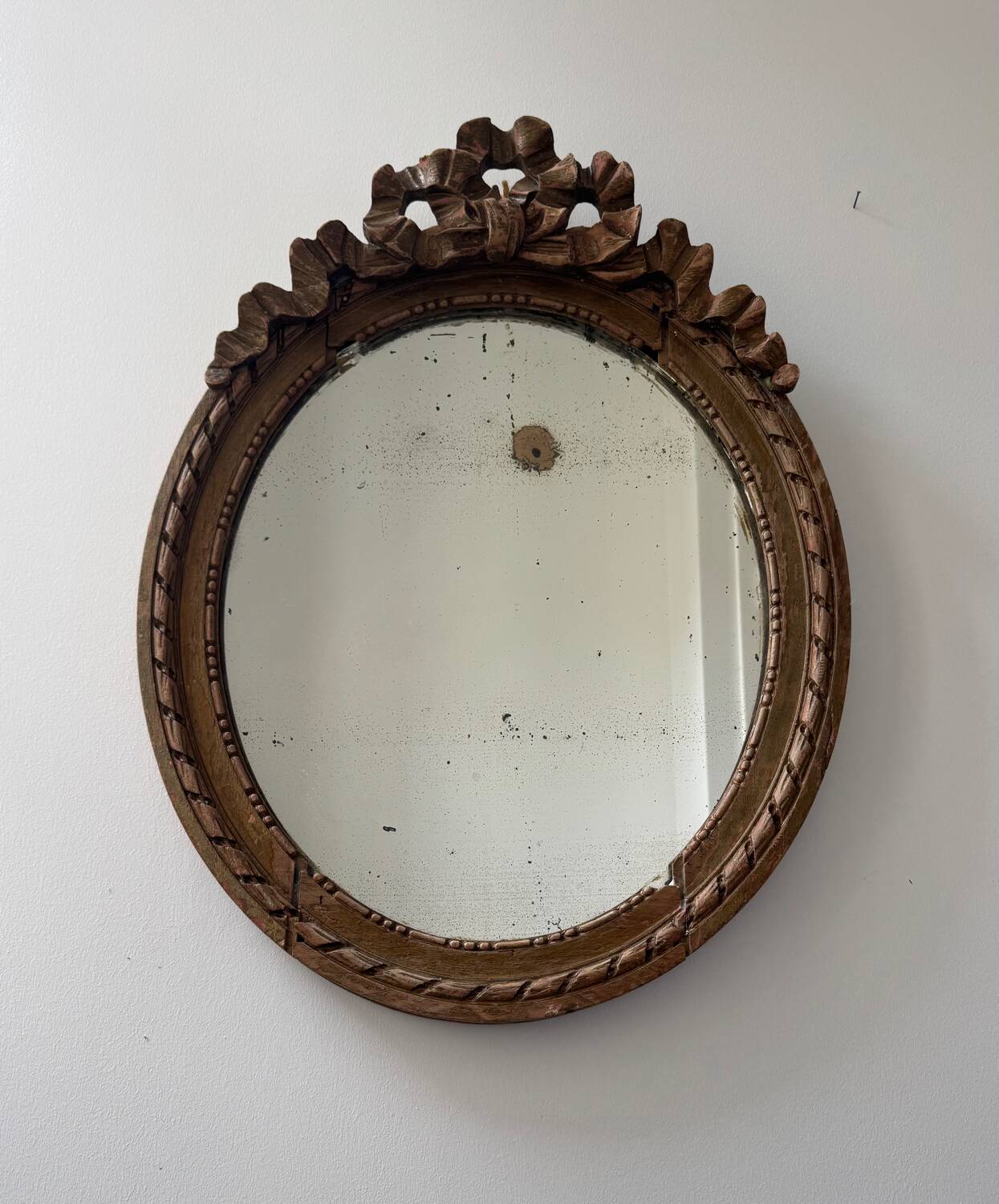 Antique Louis XVI oval knot mirror