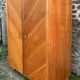 Mid-century wardrobe from the 1960s in wood, with a chevron front and tapered legs.