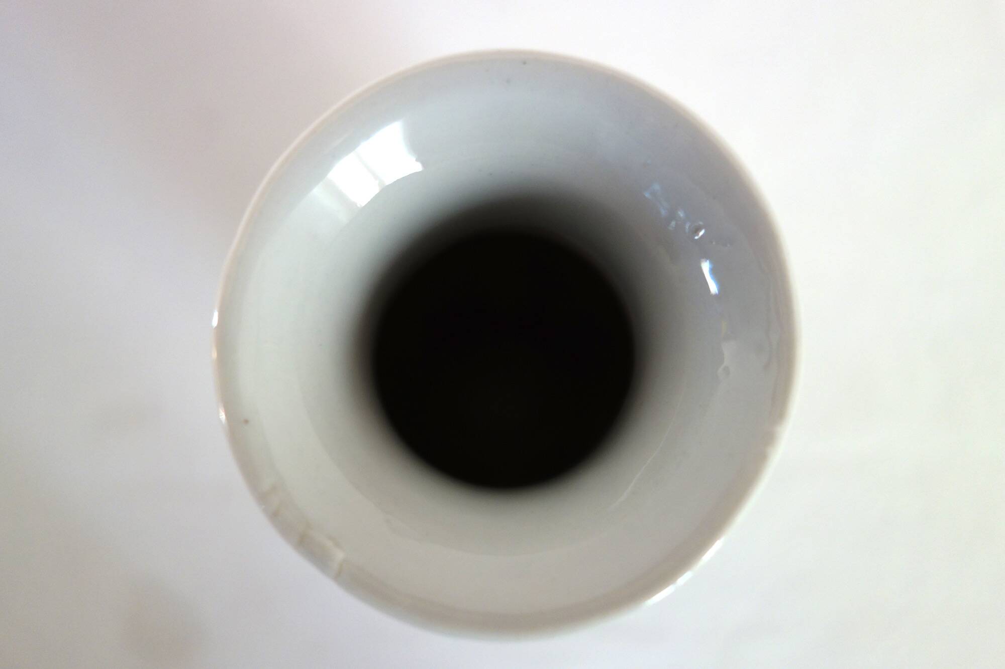 Old blue vase with vintage porcelain cherry blossoms