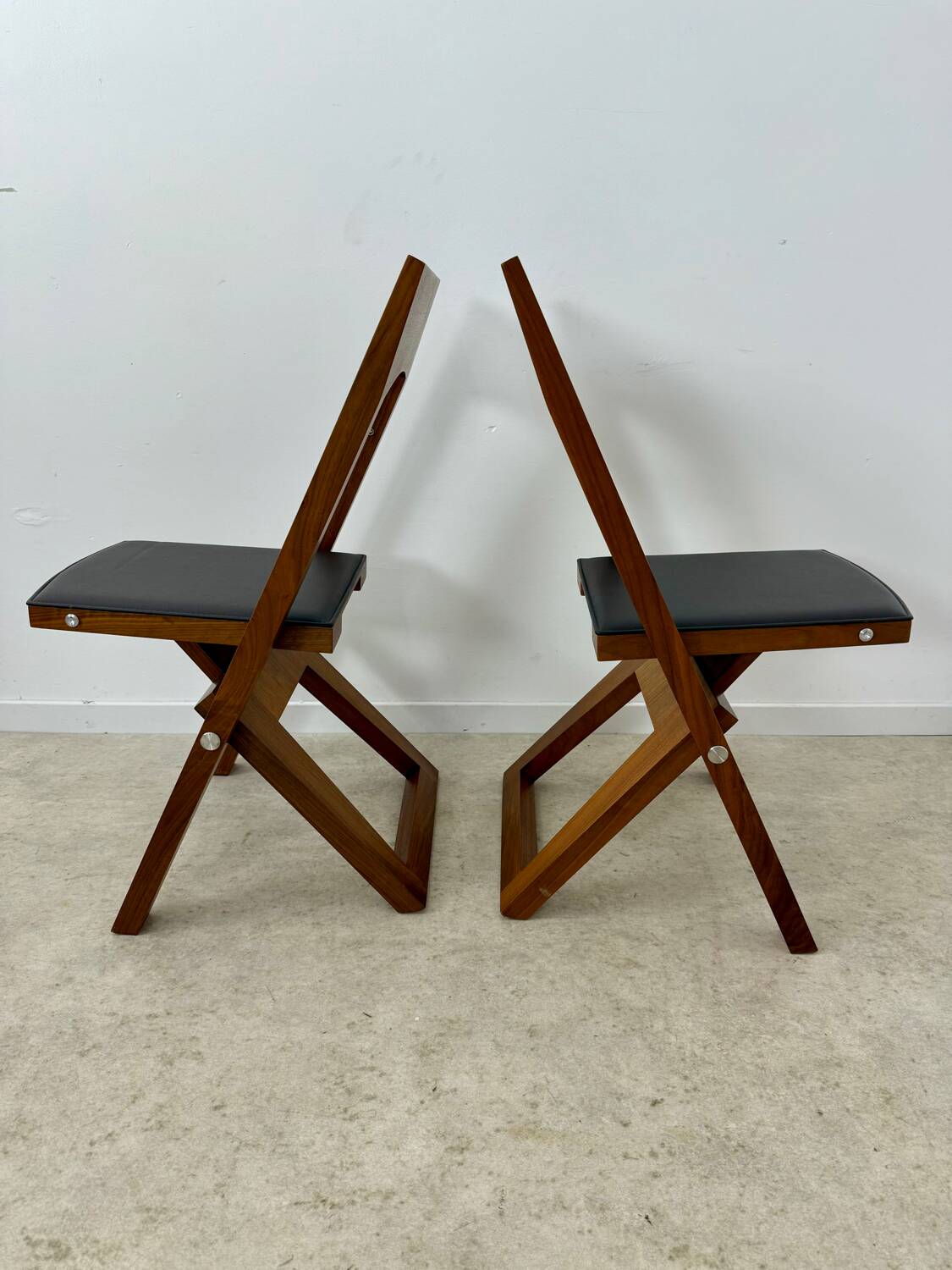 2 old folding chairs in wood and leather, postmodern design from the 80s vintage