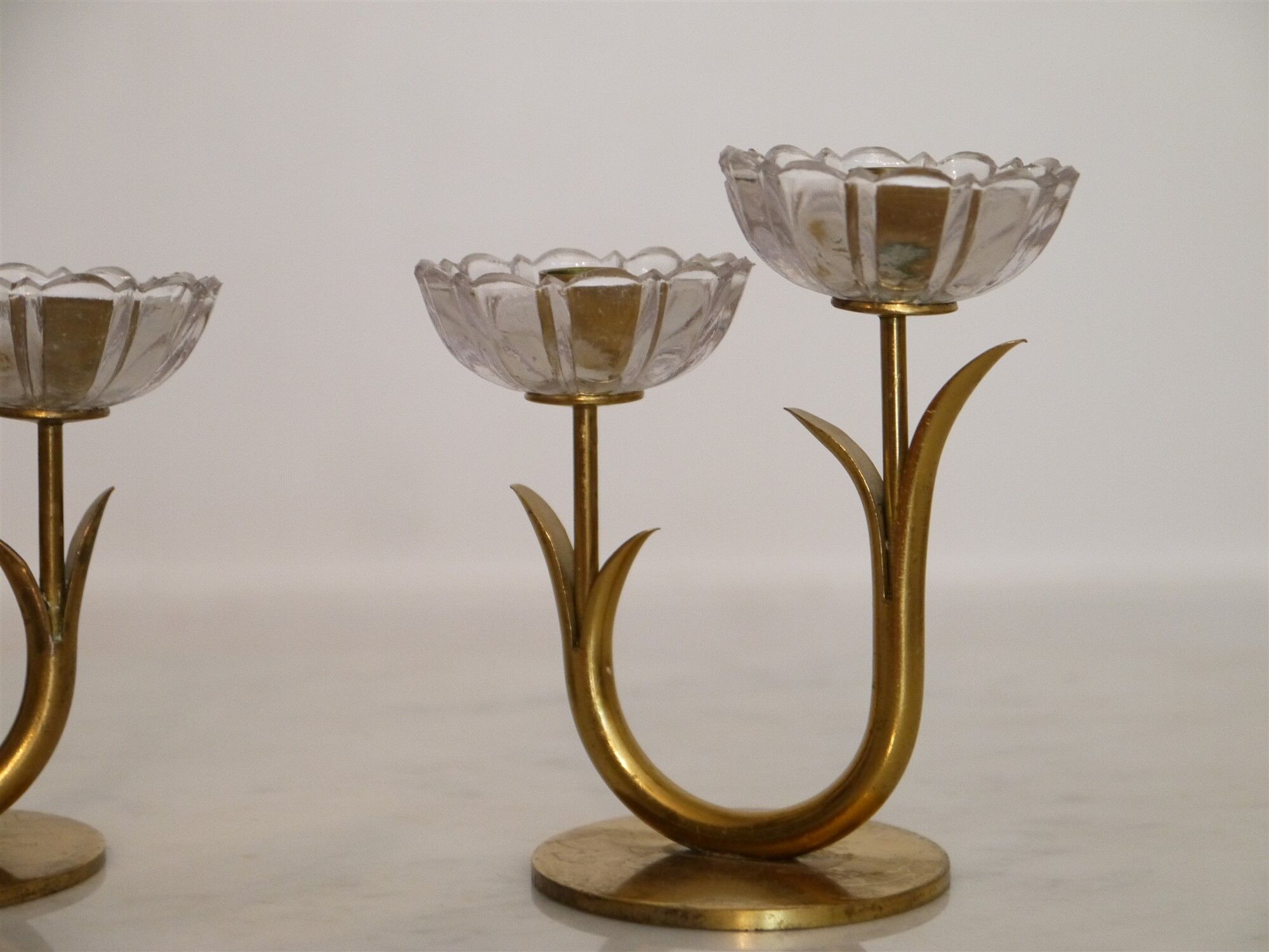 Pair of Scandinavian candlesticks made of brass and glass