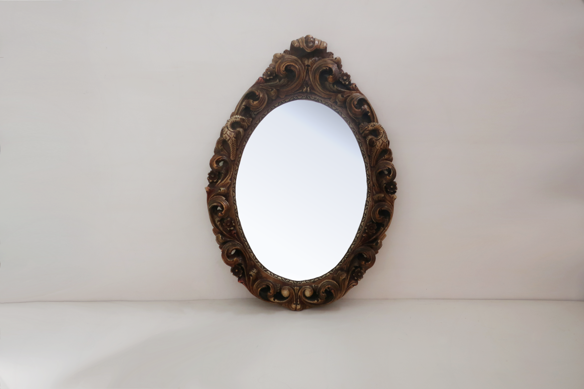 Renaissance oval mirror with bird