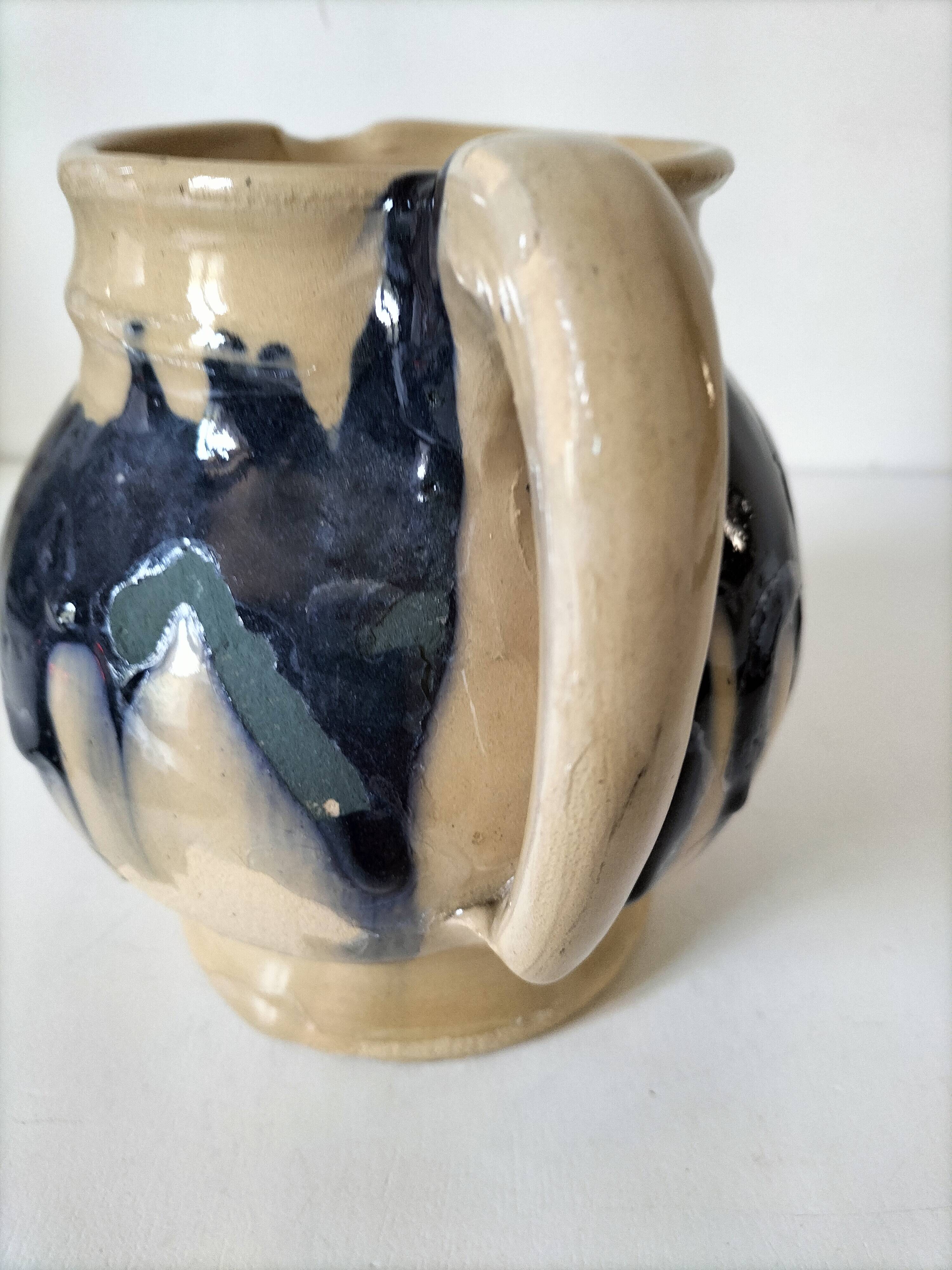 handcrafted ceramic jug with navy blue drip glaze.