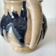 handcrafted ceramic jug with navy blue drip glaze.