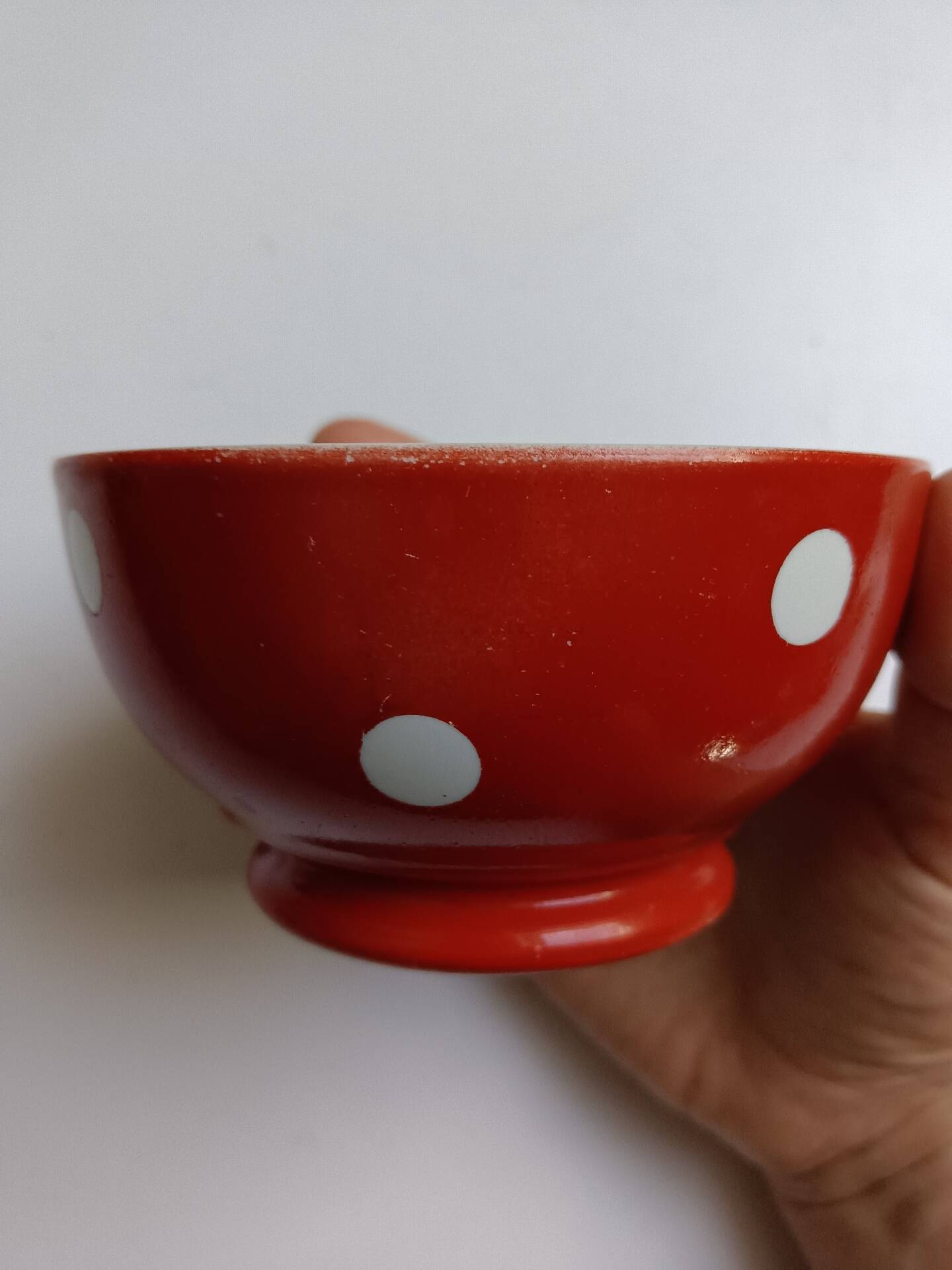 Red bowl with white polka dots in Longchamp ceramic