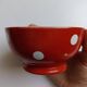 Red bowl with white polka dots in Longchamp ceramic