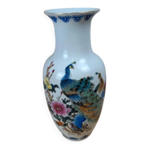 Asian vase decorated with peacock in porcelain