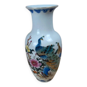 Asian vase decorated with peacock in porcelain