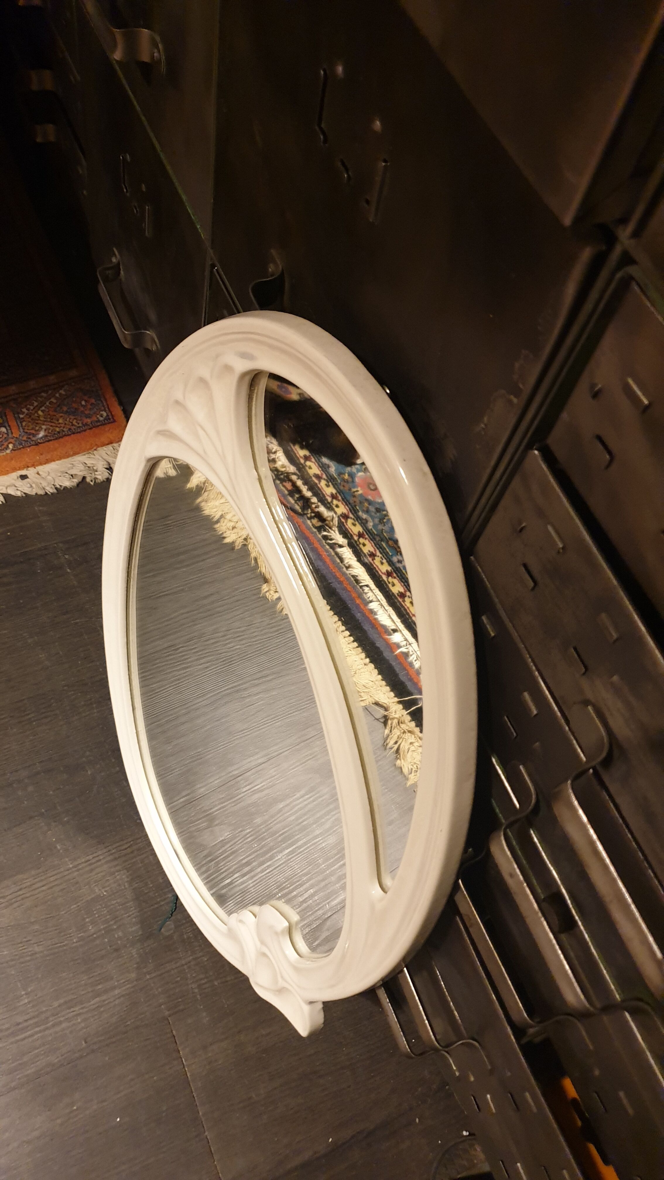 Oval cast iron mirror