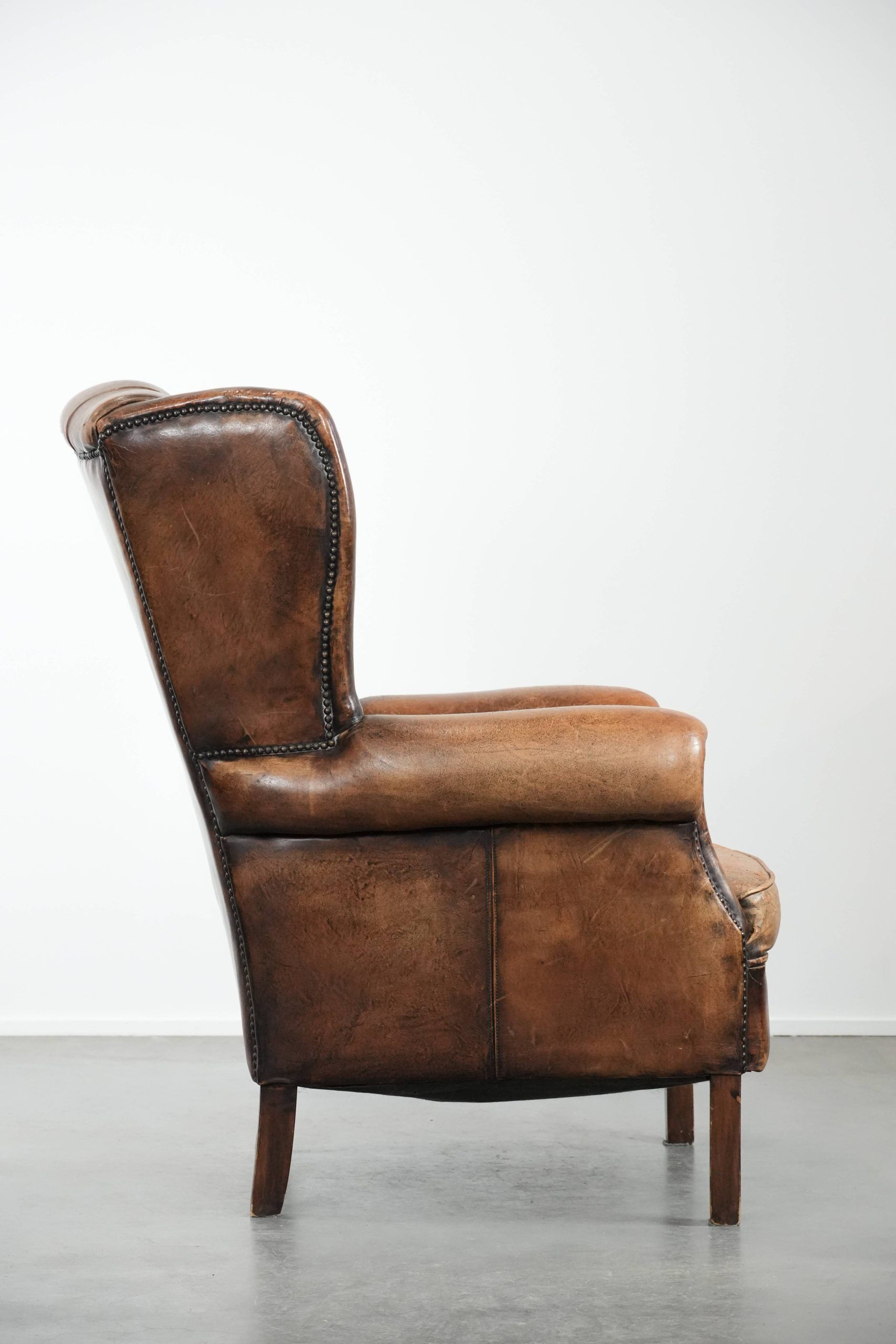 Unique large sheepskin Chesterfield wingback armchair in English style