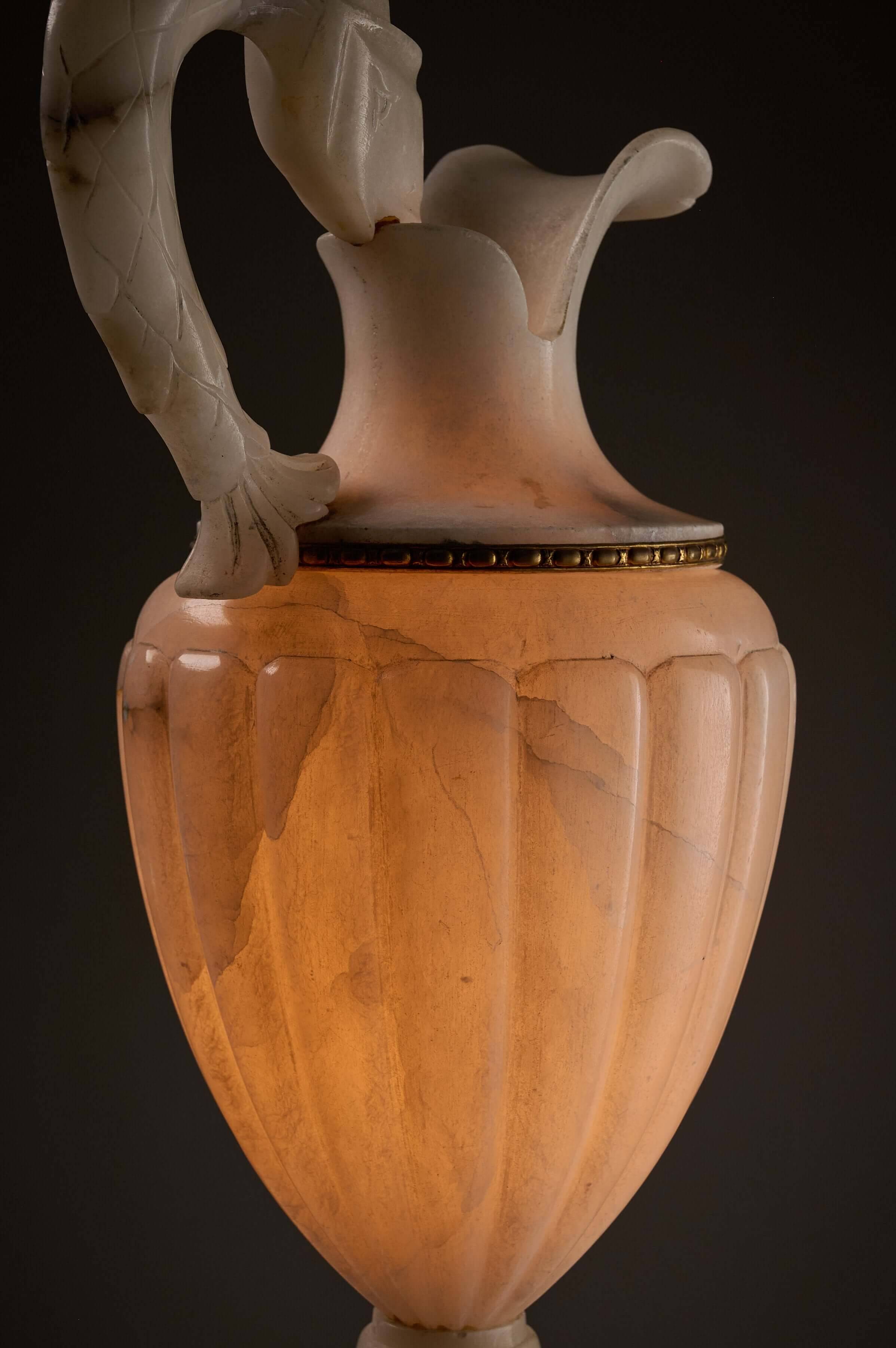 Carved alabaster urn lamp with stylized fish handle