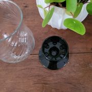 Glass candle holder with black base