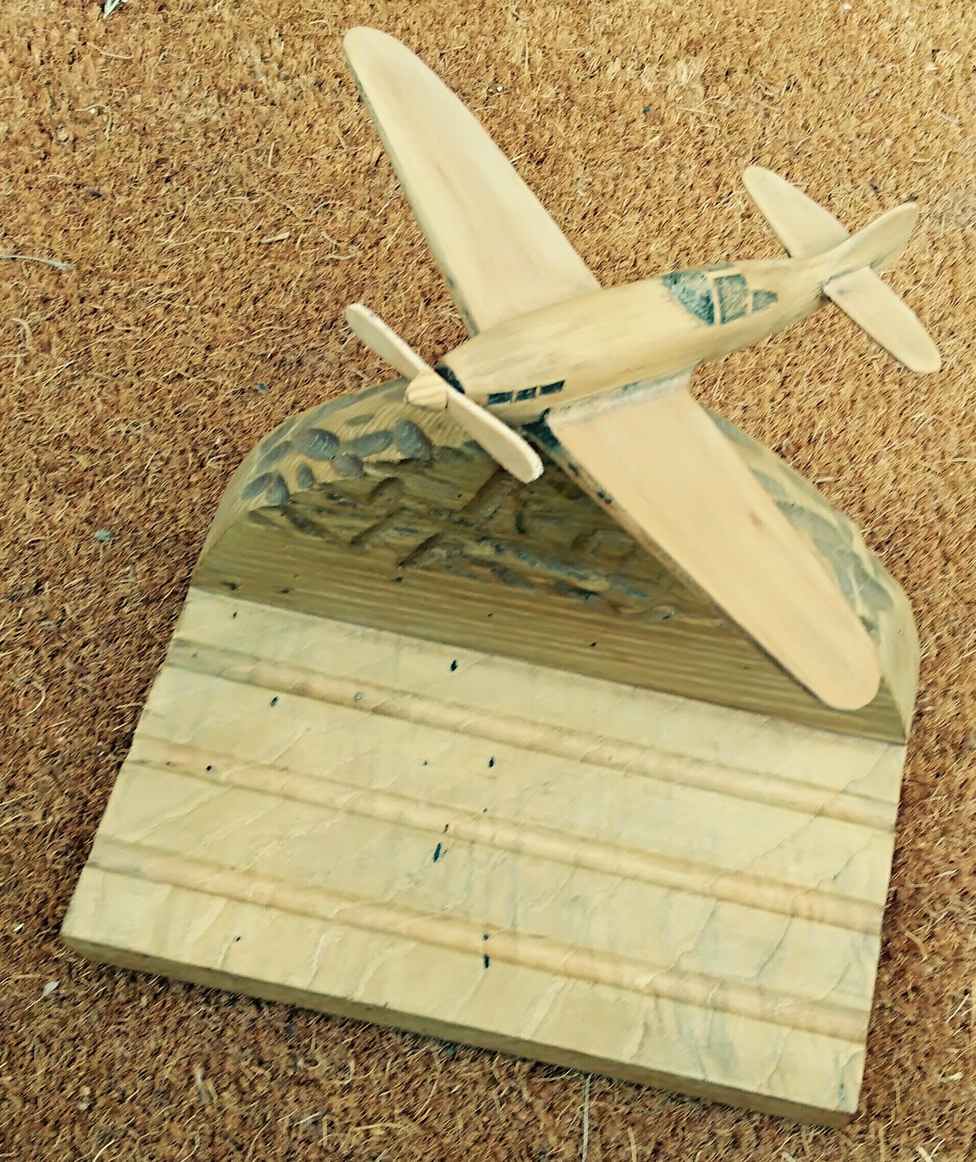 Wooden plane carved on its base, pen holder