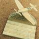 Wooden plane carved on its base, pen holder