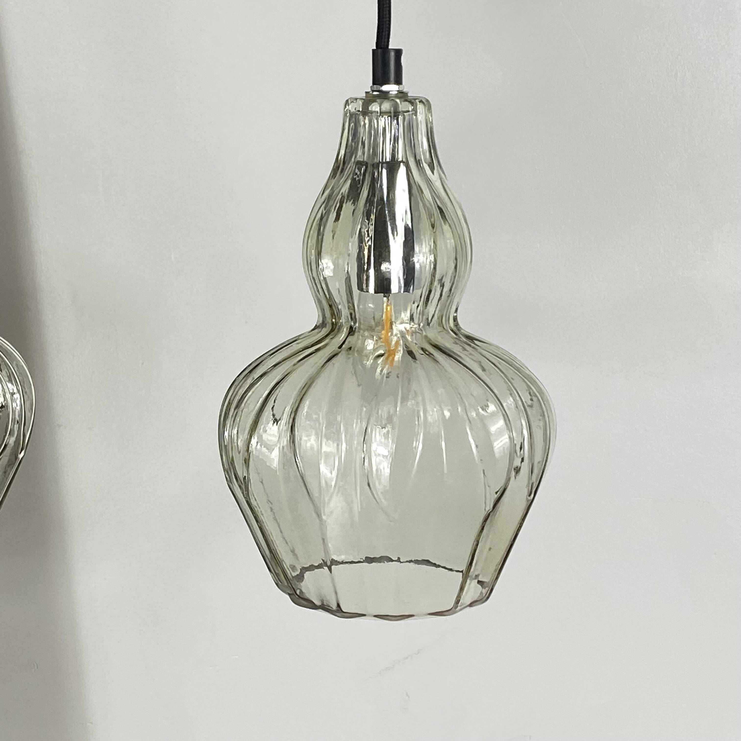 Pair of vintage glass pendant lights.