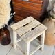 Old wooden stool with square seat