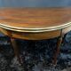 A Louis XVI period mahogany half-moon table forming a console/games table