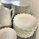 Prestigious 62-piece dinnerware set in vintage 70's Limoges white porcelain by Raynaud