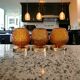 Set of three vintage wall or ceiling lights in amber chiseled glass