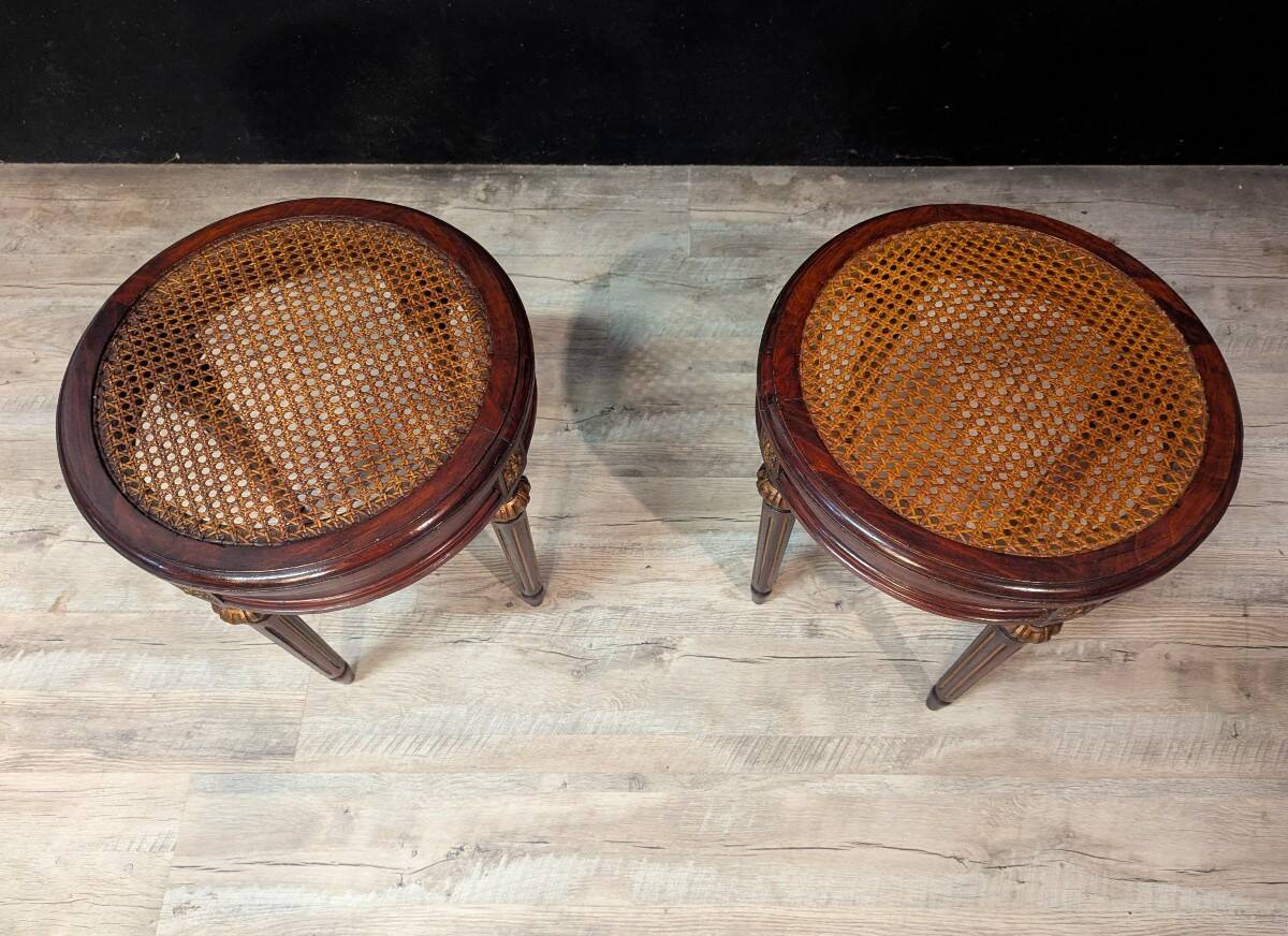 Pair of Louis XVI style stools with caned seats.